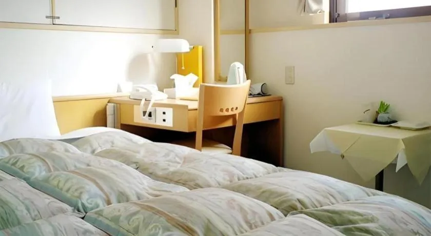 Bed in Hotel Sunshine Iwaki