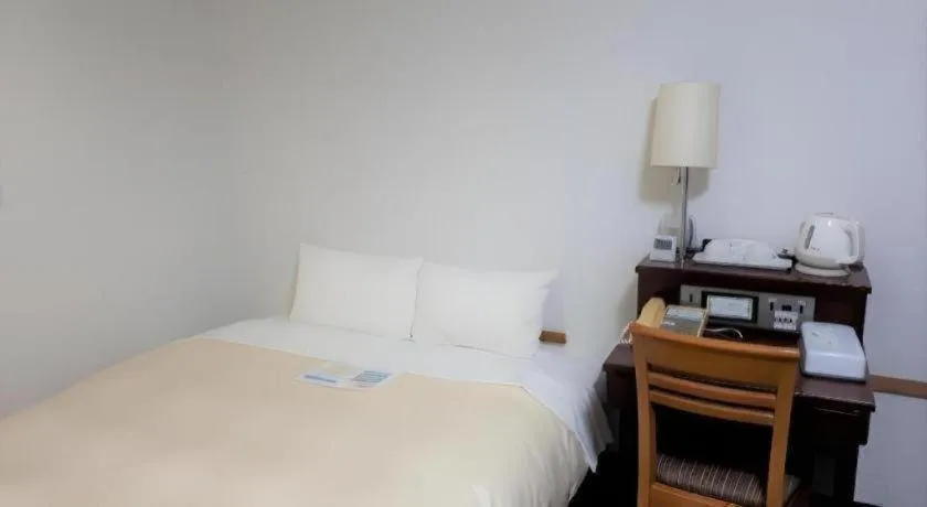 Bed in Hotel Sunshine Iwaki