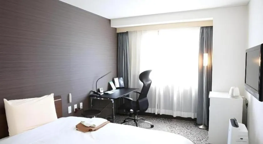 Bed in Hotel Sunshine Iwaki