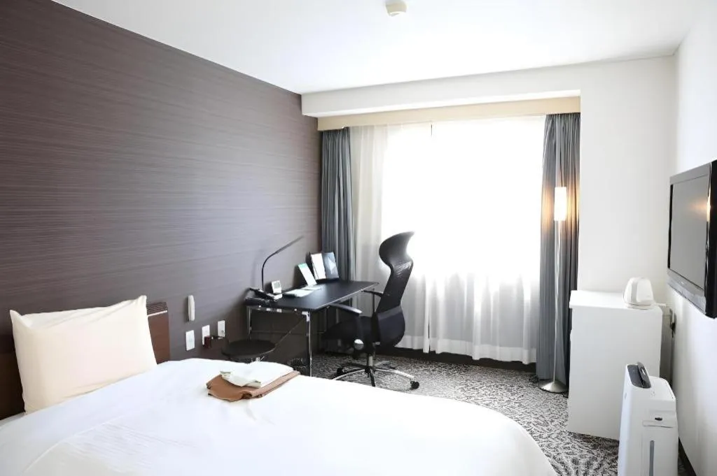 Bed in Hotel Sunshine Iwaki