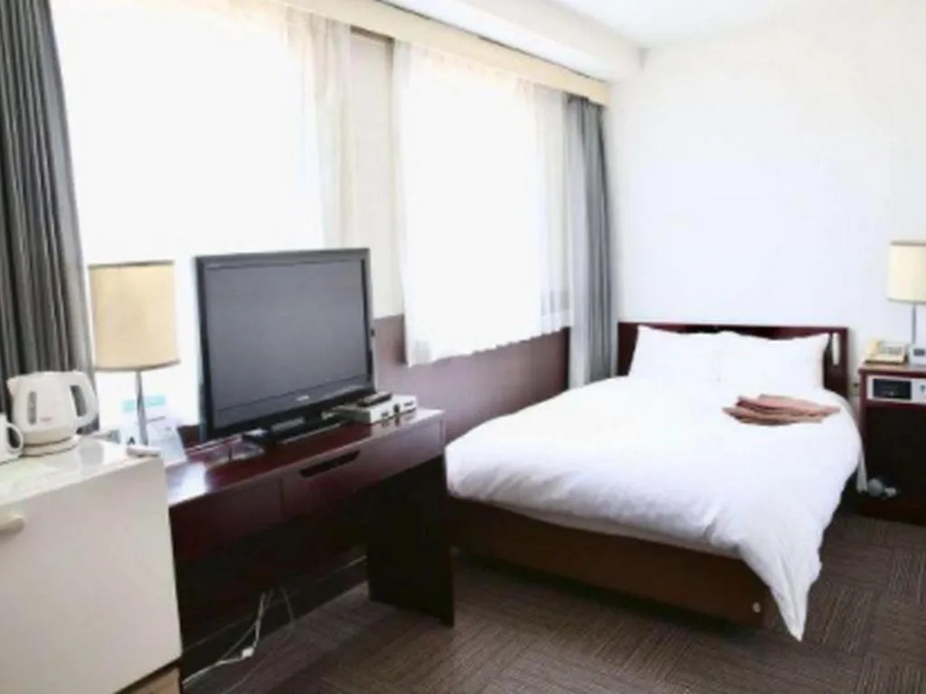 Bed in Hotel Sunshine Iwaki