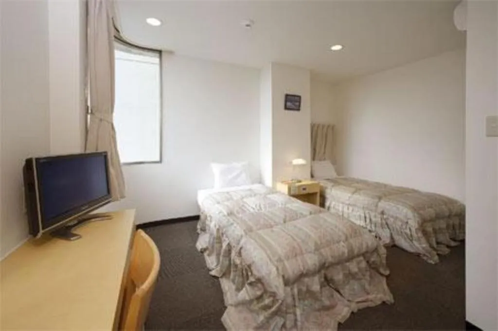 Bed in Hotel Sunshine Iwaki