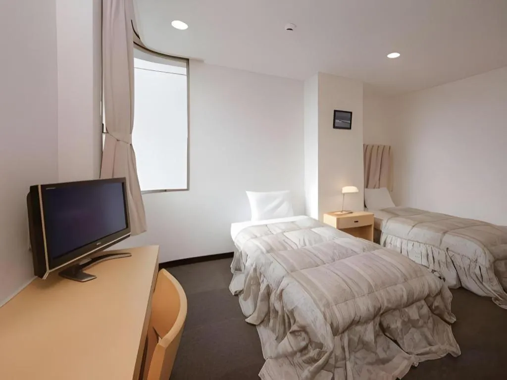 Bed in Hotel Sunshine Iwaki