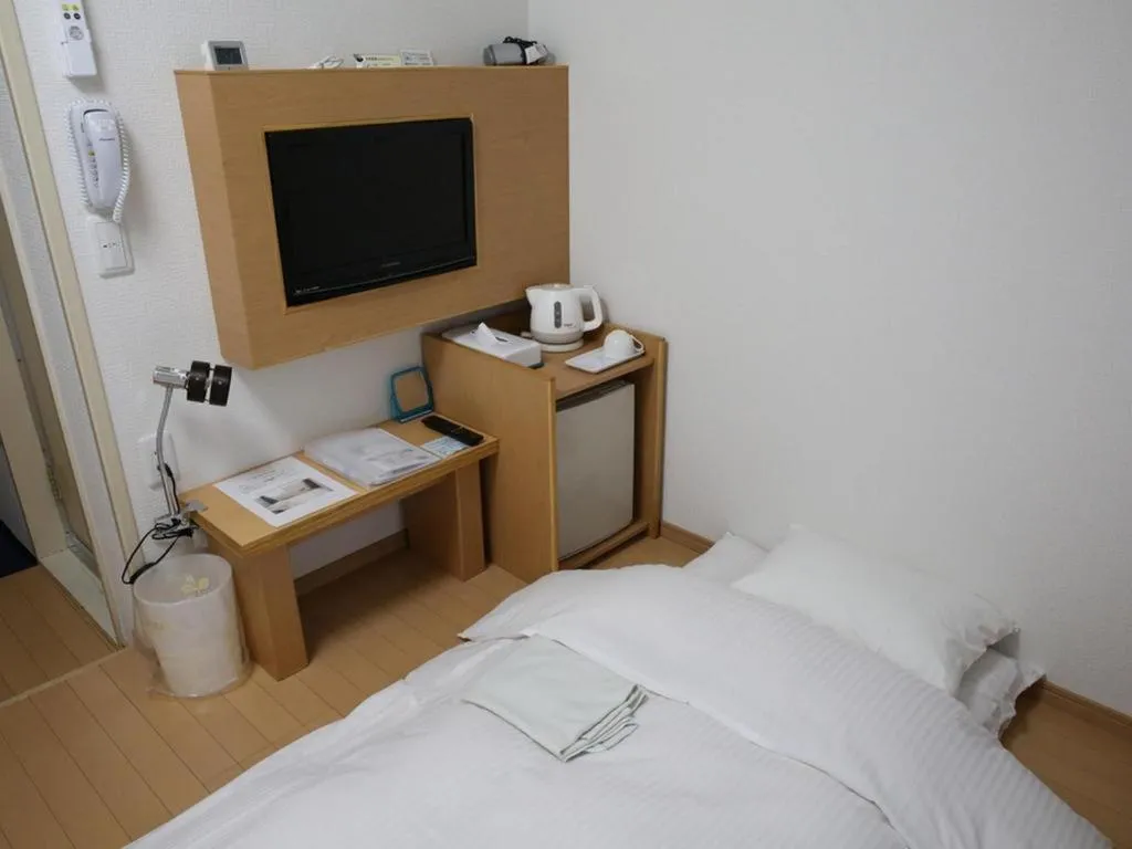 Bed in Hotel Sunshine Iwaki