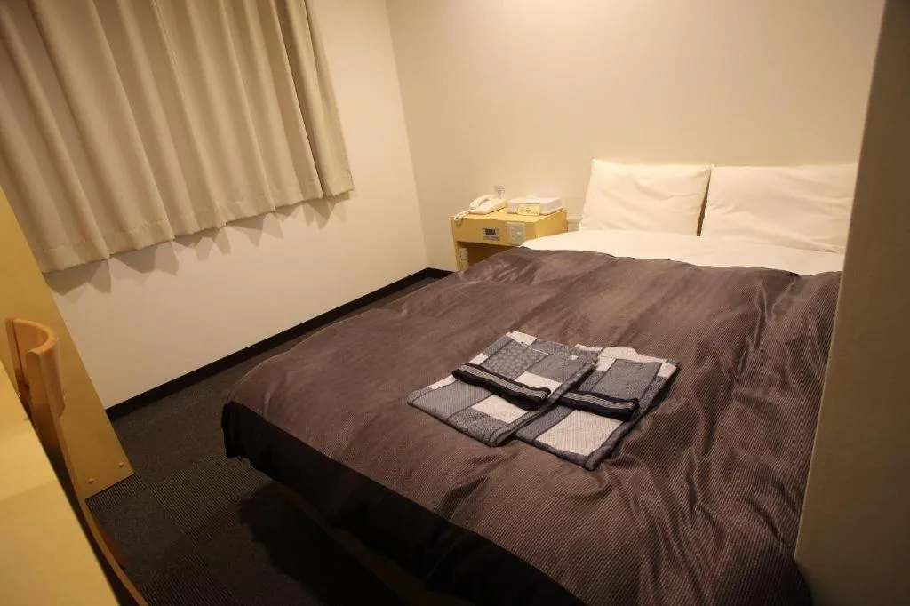 Bed in Hotel Sunshine Iwaki