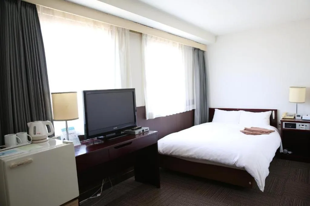 Bed in Hotel Sunshine Iwaki