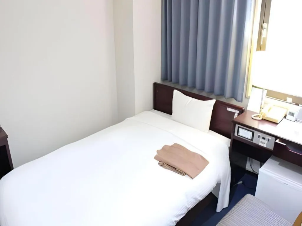 Bed in Hotel Sunshine Iwaki