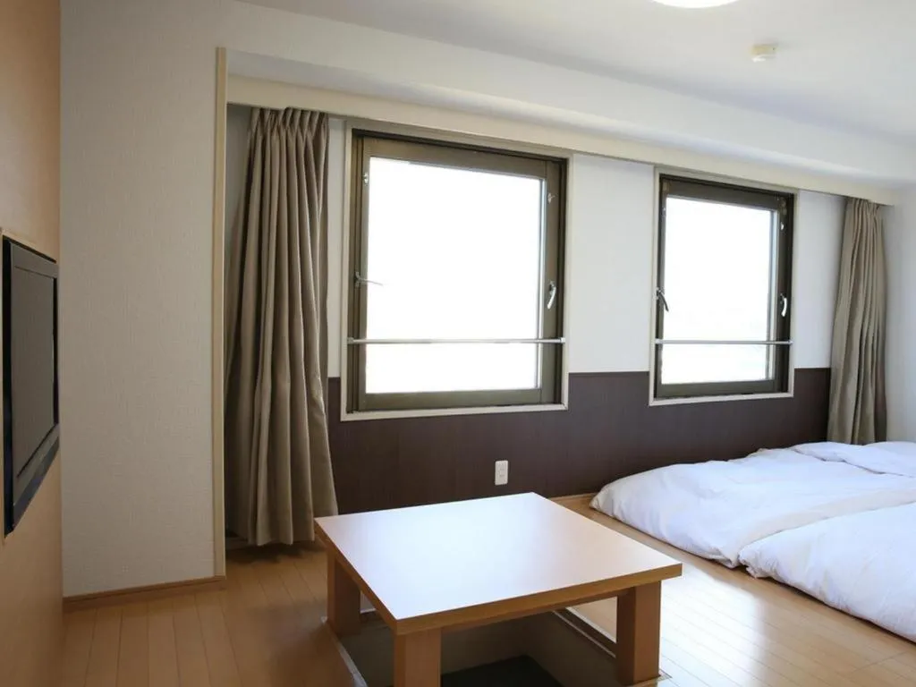 Bed in Hotel Sunshine Iwaki