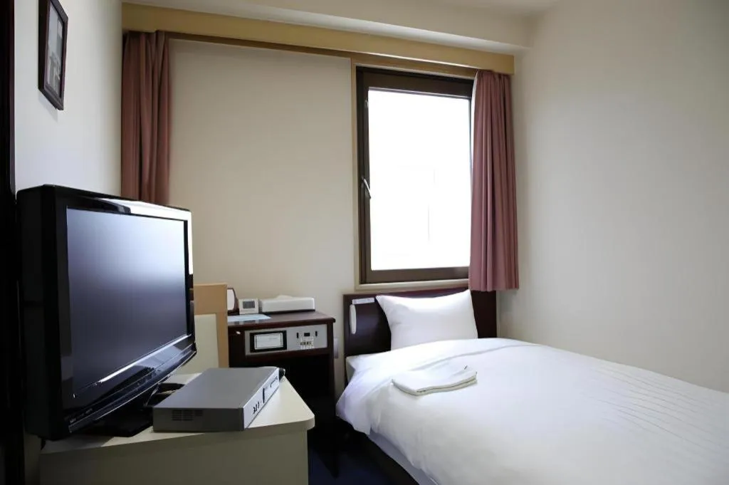 Bed in Hotel Sunshine Iwaki