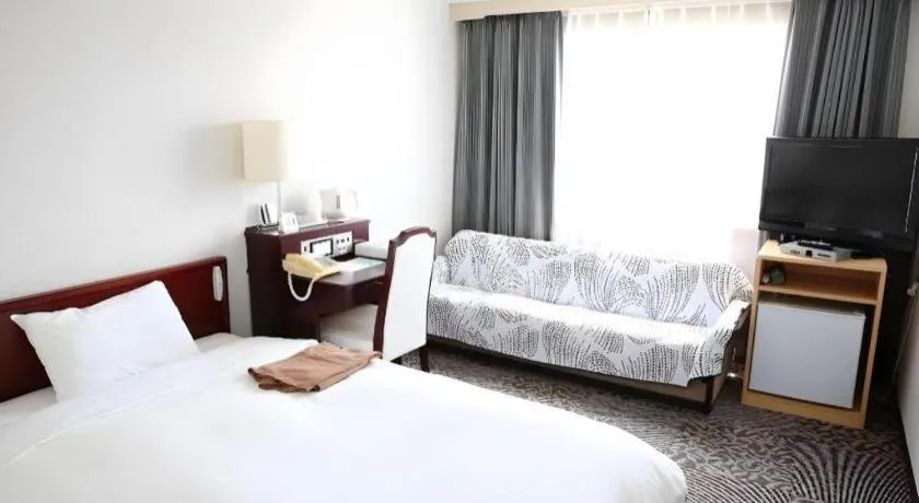 Bed in Hotel Sunshine Iwaki