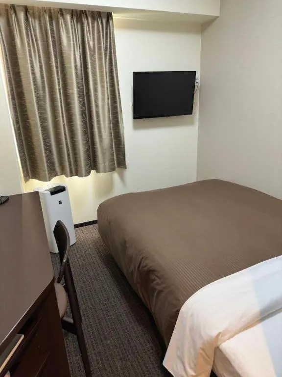 Bed in E Hotel Kumagaya Annex