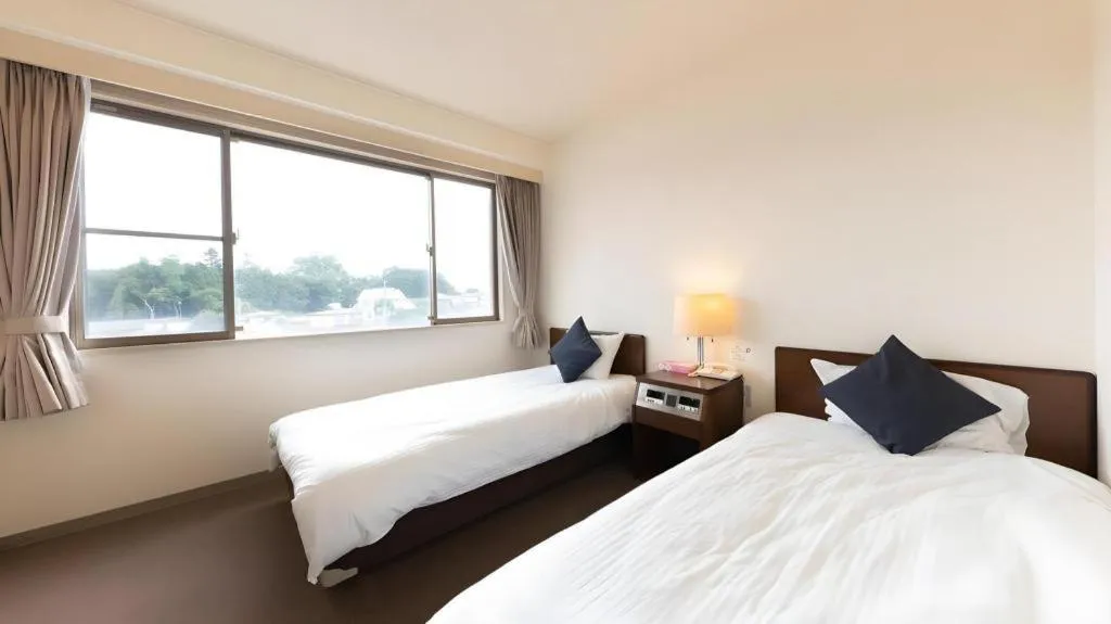 Bed in Tabist Yabuki Station Hotel