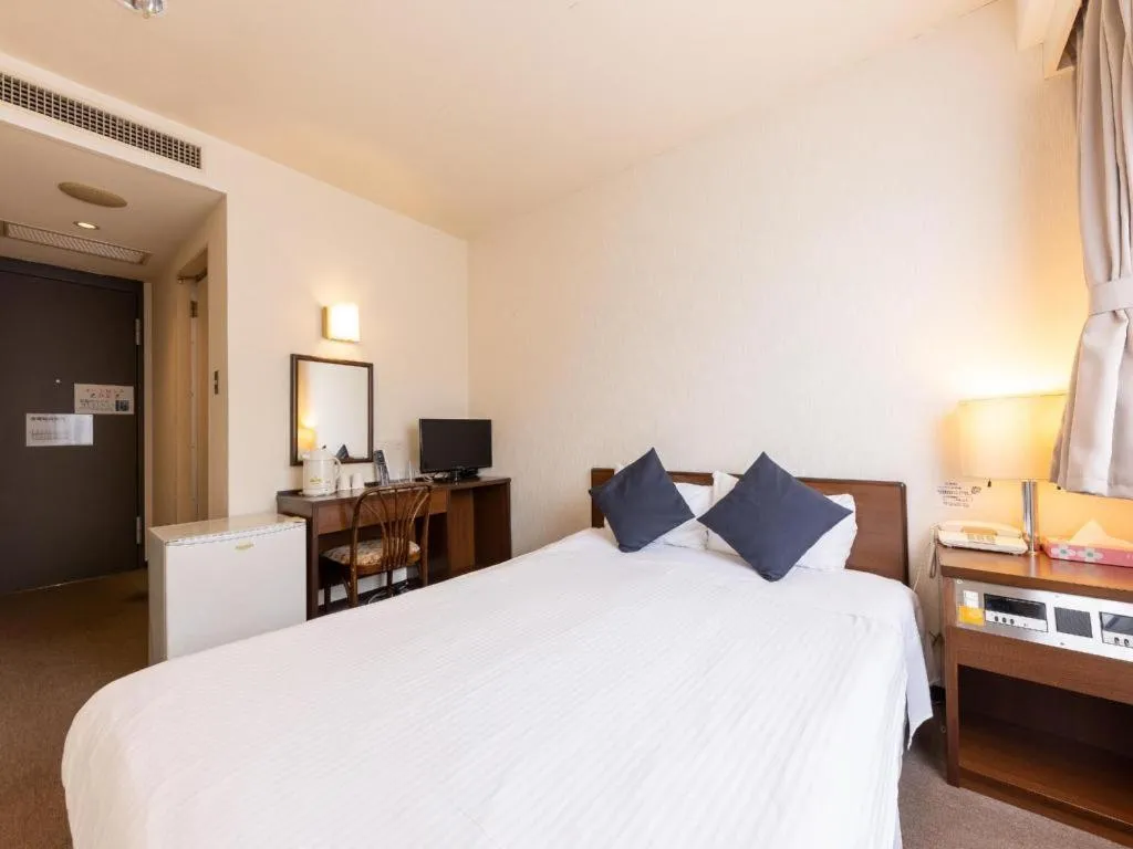 Bed in Tabist Yabuki Station Hotel