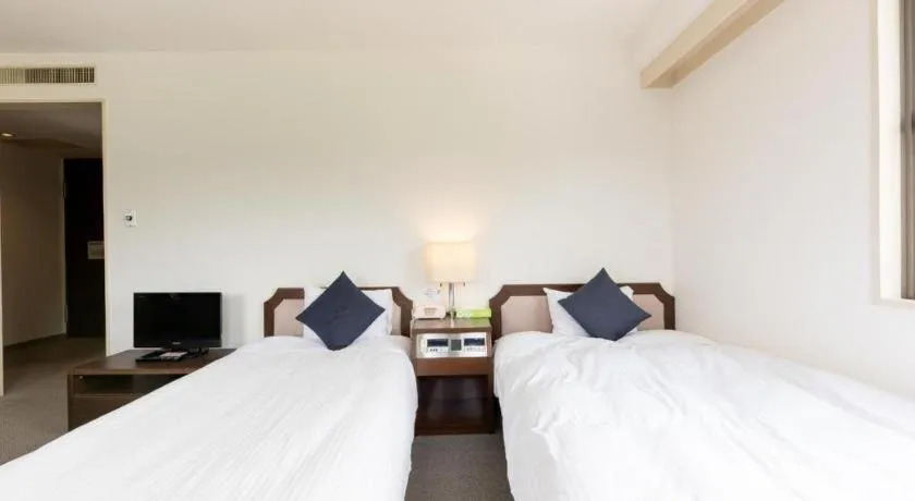 Bed in Tabist Yabuki Station Hotel