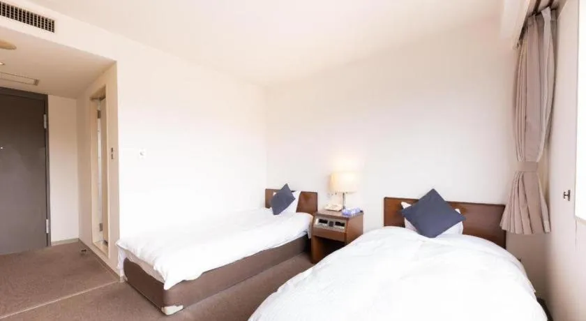 Bed in Tabist Yabuki Station Hotel