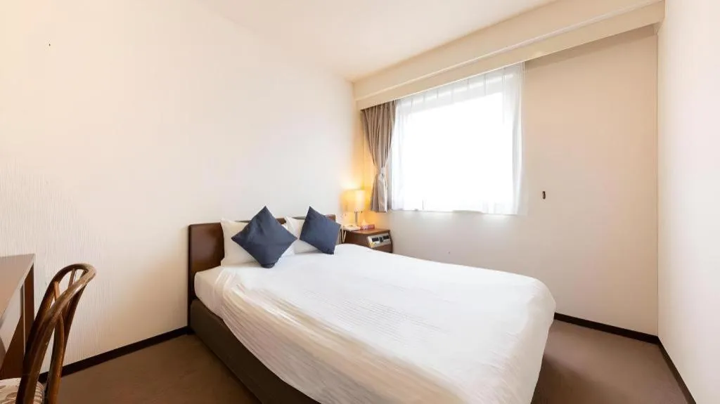 Bed in Tabist Yabuki Station Hotel