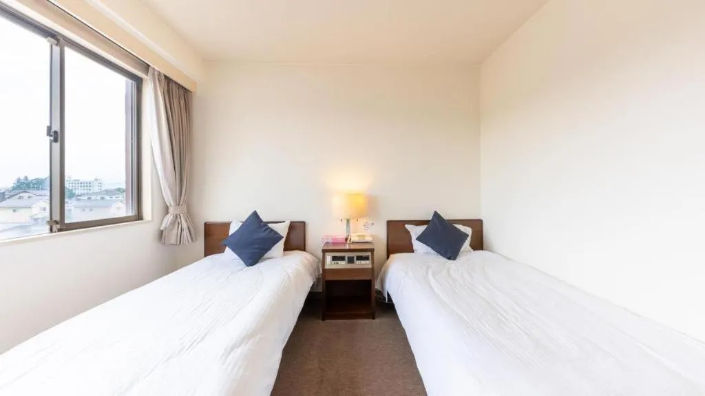 Bed in Tabist Yabuki Station Hotel