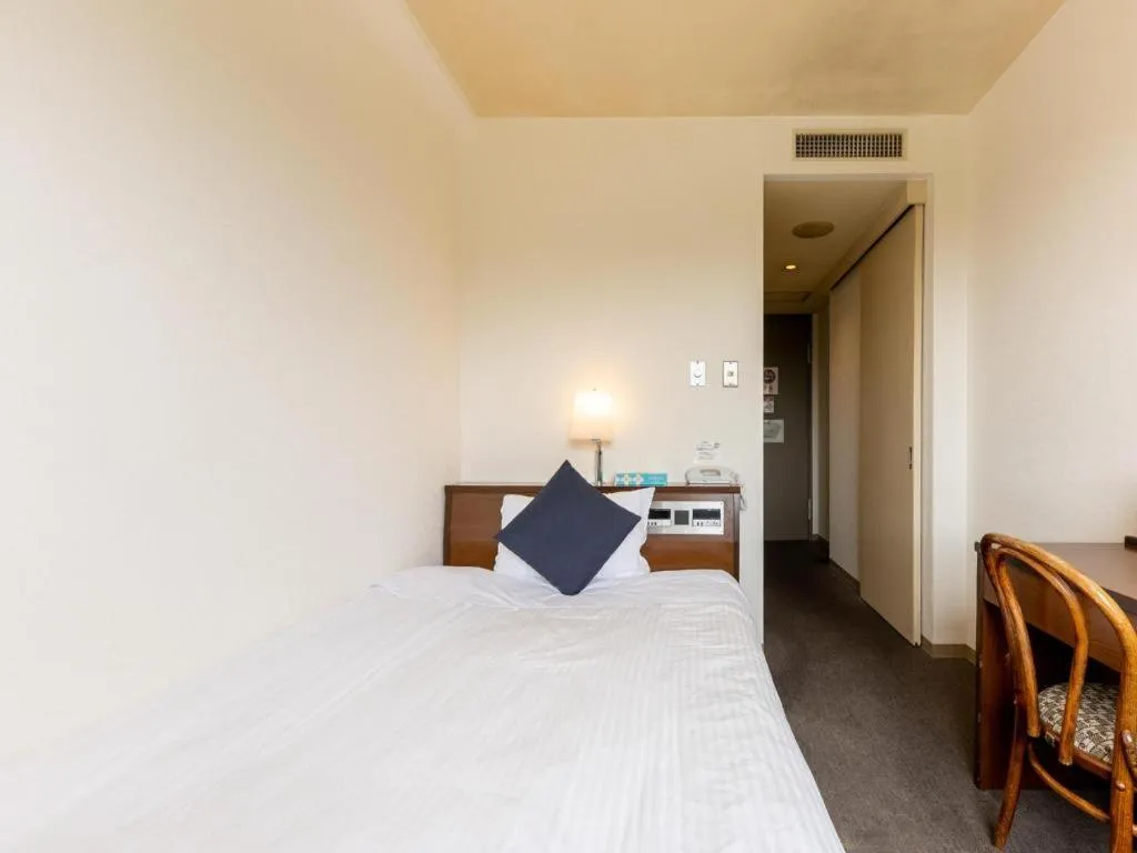 Bed in Tabist Yabuki Station Hotel