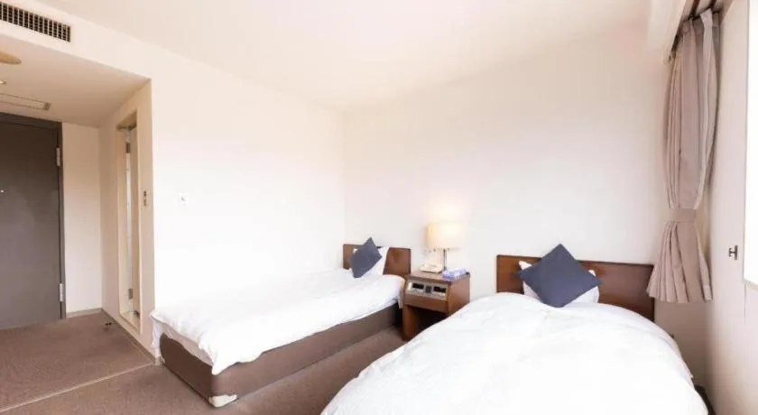 Bed in Tabist Yabuki Station Hotel