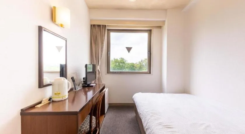 Bed in Tabist Yabuki Station Hotel