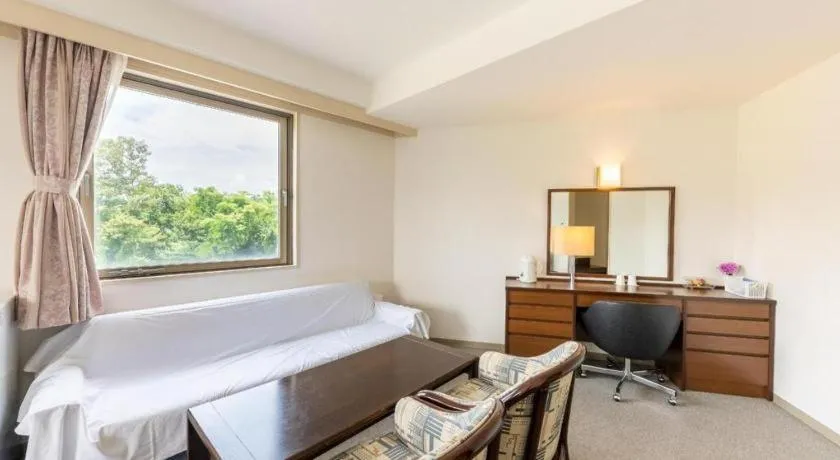 Bed in Tabist Yabuki Station Hotel