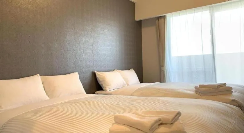 Bed in Mr.KINJO LINK in KUME NAHA