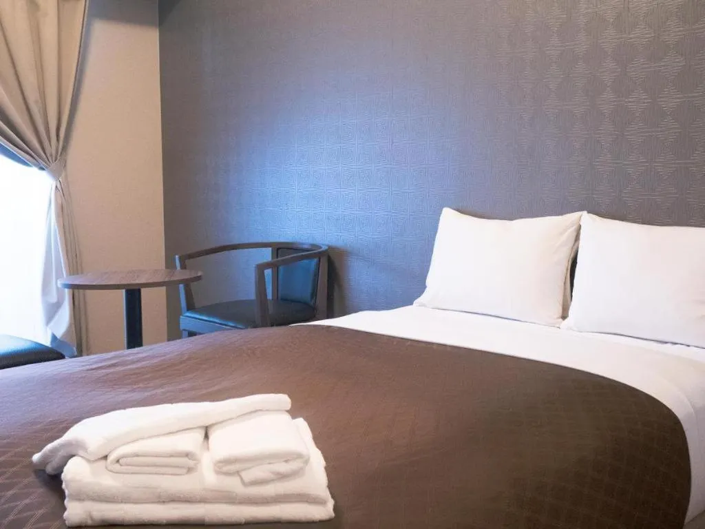 Bed in Mr.KINJO LINK in KUME NAHA