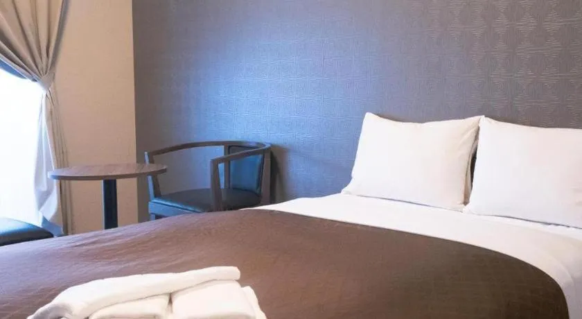 Bed in Mr.KINJO LINK in KUME NAHA