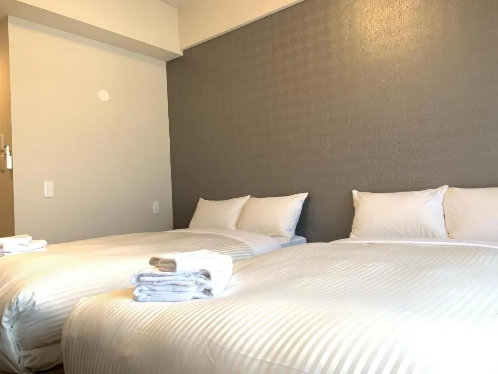 Bed in Mr.KINJO LINK in KUME NAHA