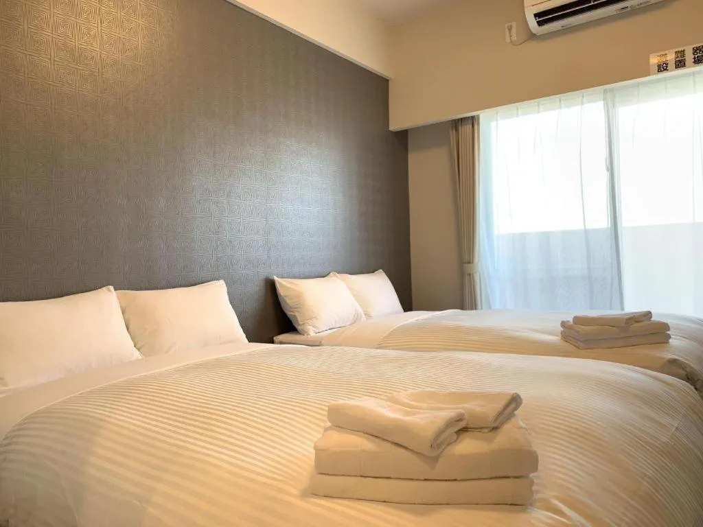 Bed in Mr.KINJO LINK in KUME NAHA