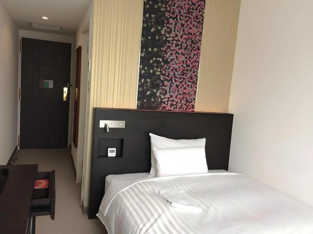 Bed in JR-EAST HOTEL METS NAGAOKA
