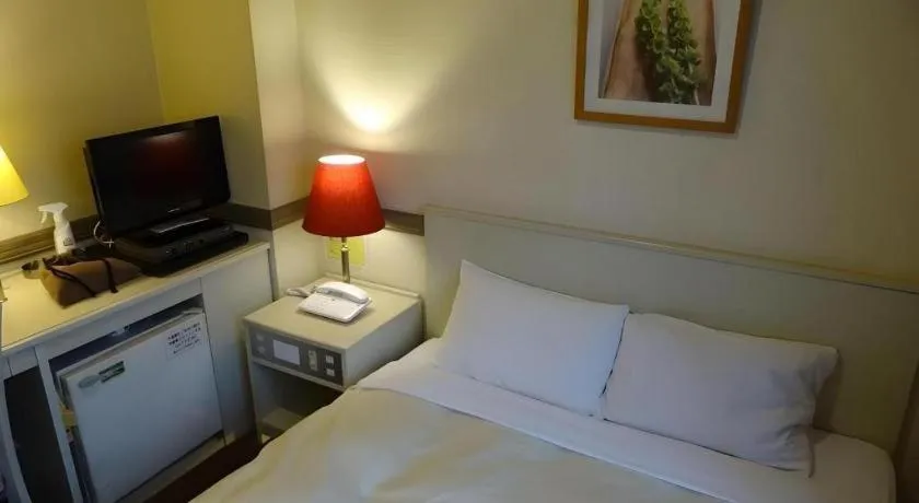 Bed in Matsumoto Wellton Hotel