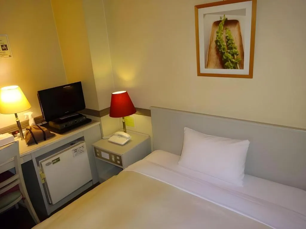 Bed in Matsumoto Wellton Hotel