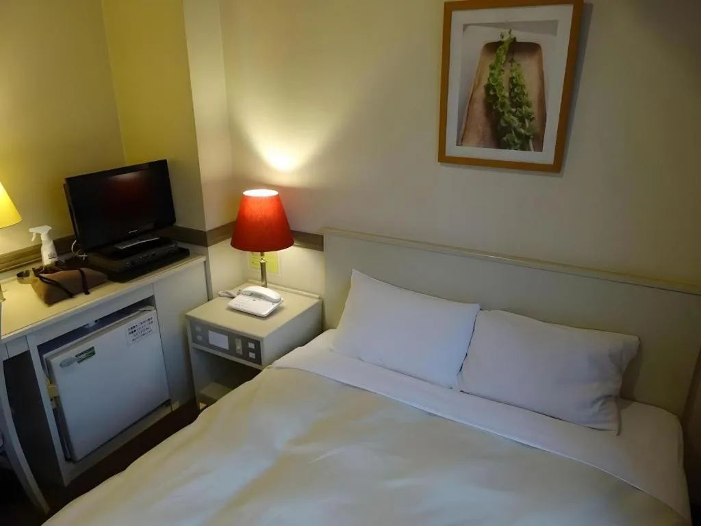 Bed in Matsumoto Wellton Hotel