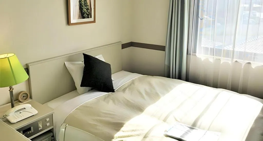Bed in Matsumoto Wellton Hotel