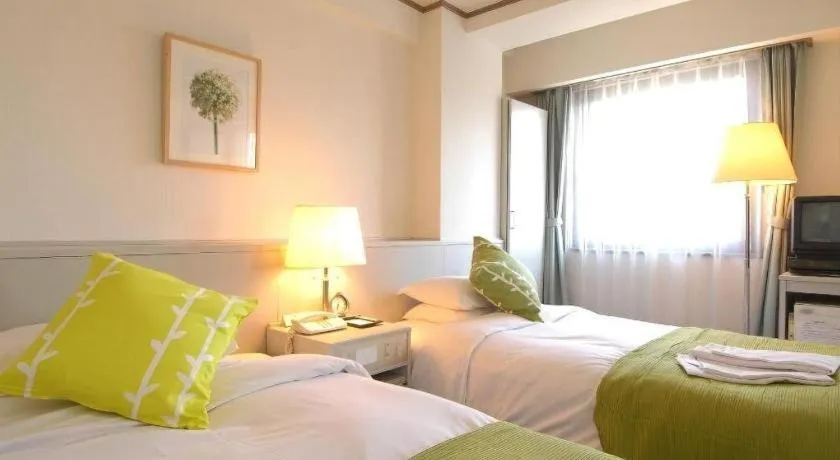 Bed in Matsumoto Wellton Hotel