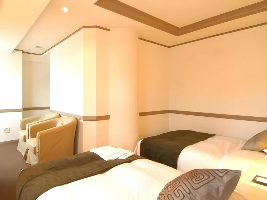 Bed in Matsumoto Wellton Hotel