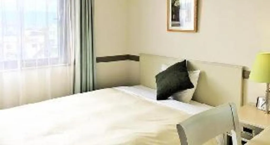 Bed in Matsumoto Wellton Hotel