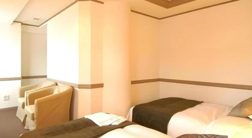 Bed in Matsumoto Wellton Hotel