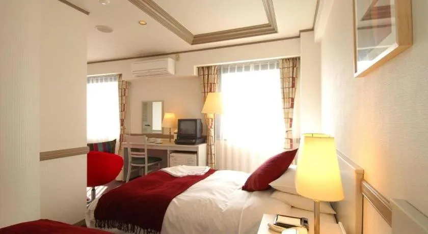 Bed in Matsumoto Wellton Hotel