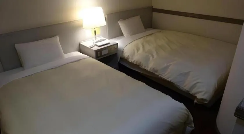 Bed in Matsumoto Wellton Hotel