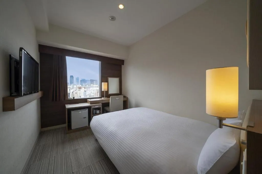 Bed in Hotel Oriental Express Nagoya Sakae