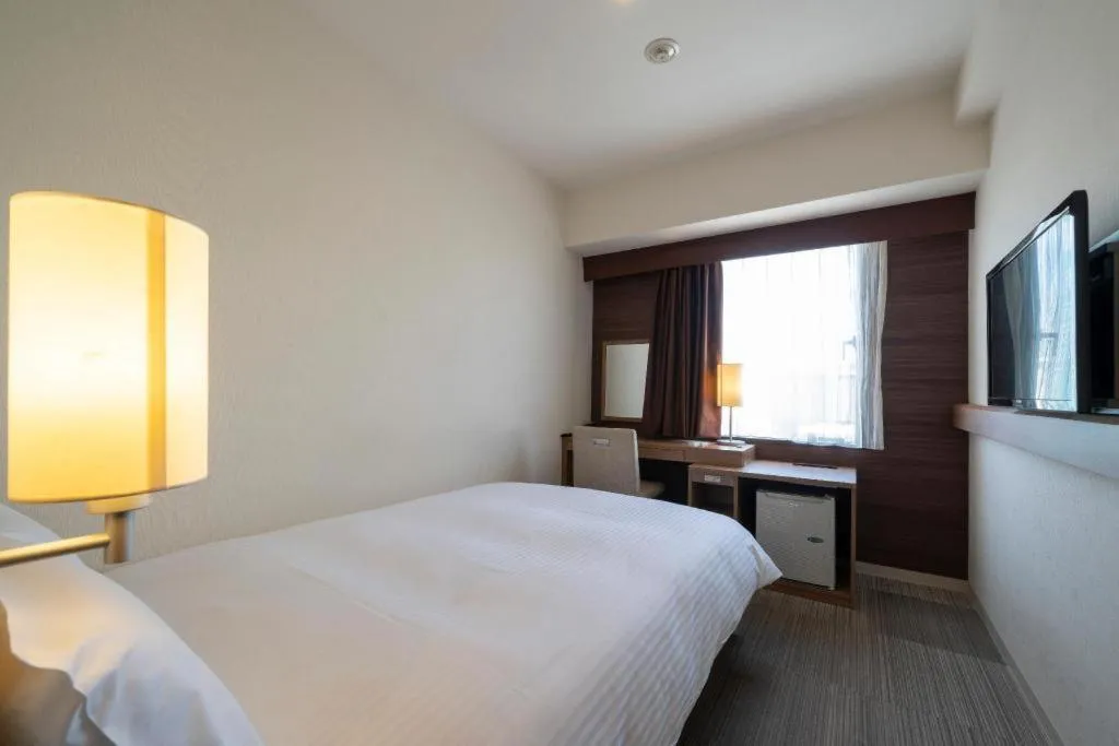 Bed in Hotel Oriental Express Nagoya Sakae