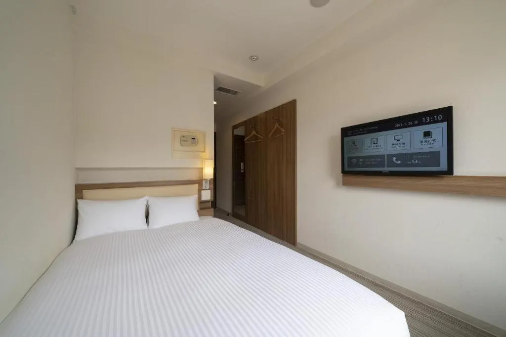 Bed in Hotel Oriental Express Nagoya Sakae