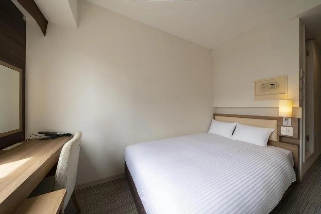 Bed in Hotel Oriental Express Nagoya Sakae