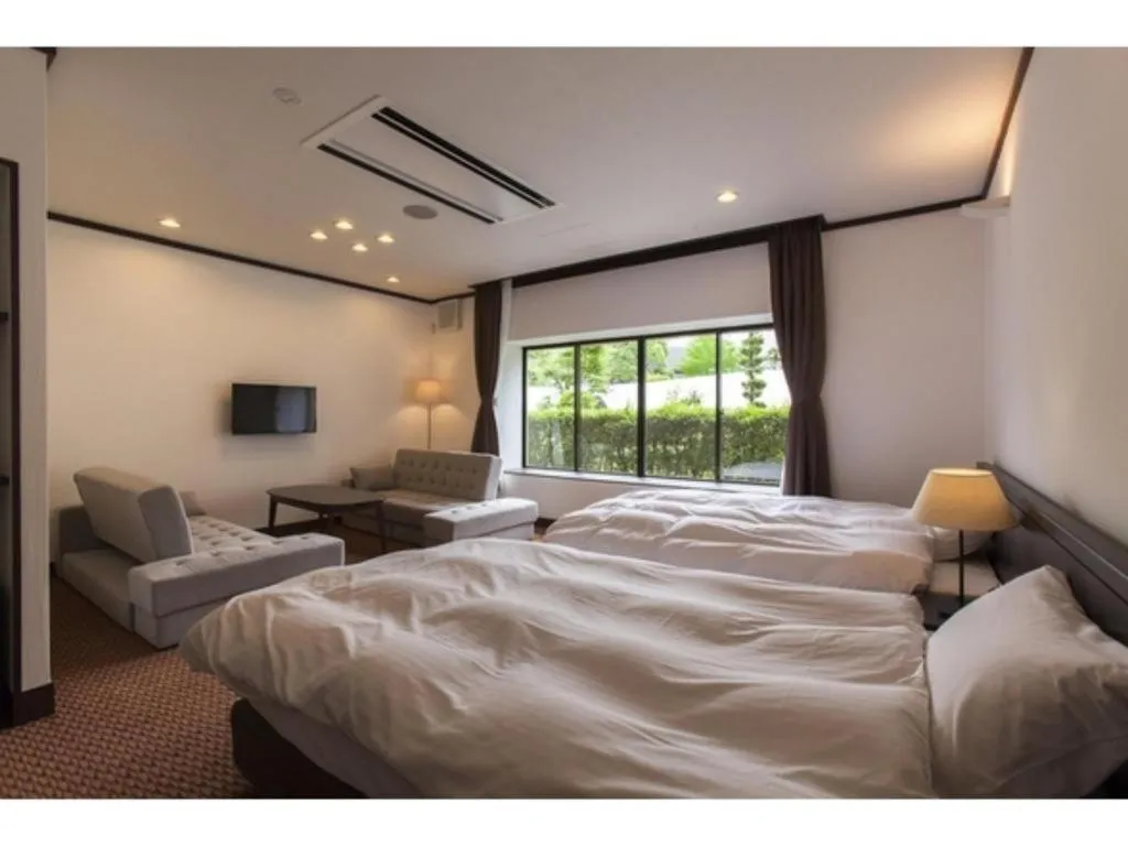 Bed in Hotel Silk Onsen Yamabiko