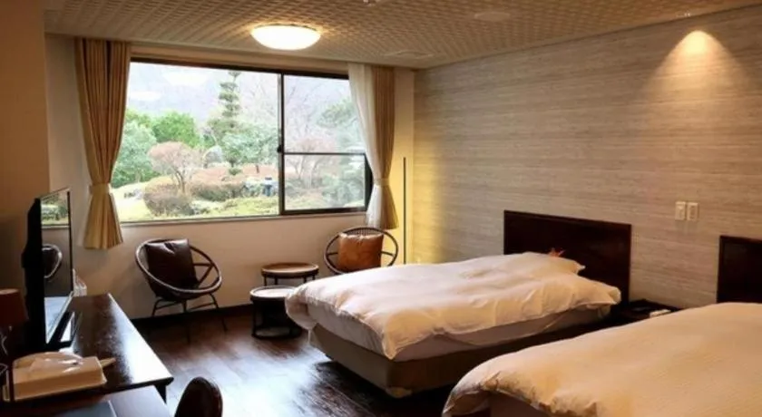 Bed in Hotel Silk Onsen Yamabiko