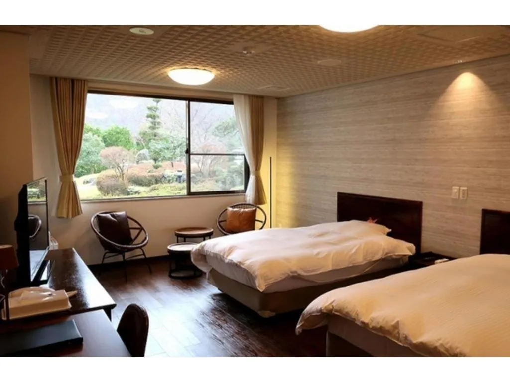 Bed in Hotel Silk Onsen Yamabiko