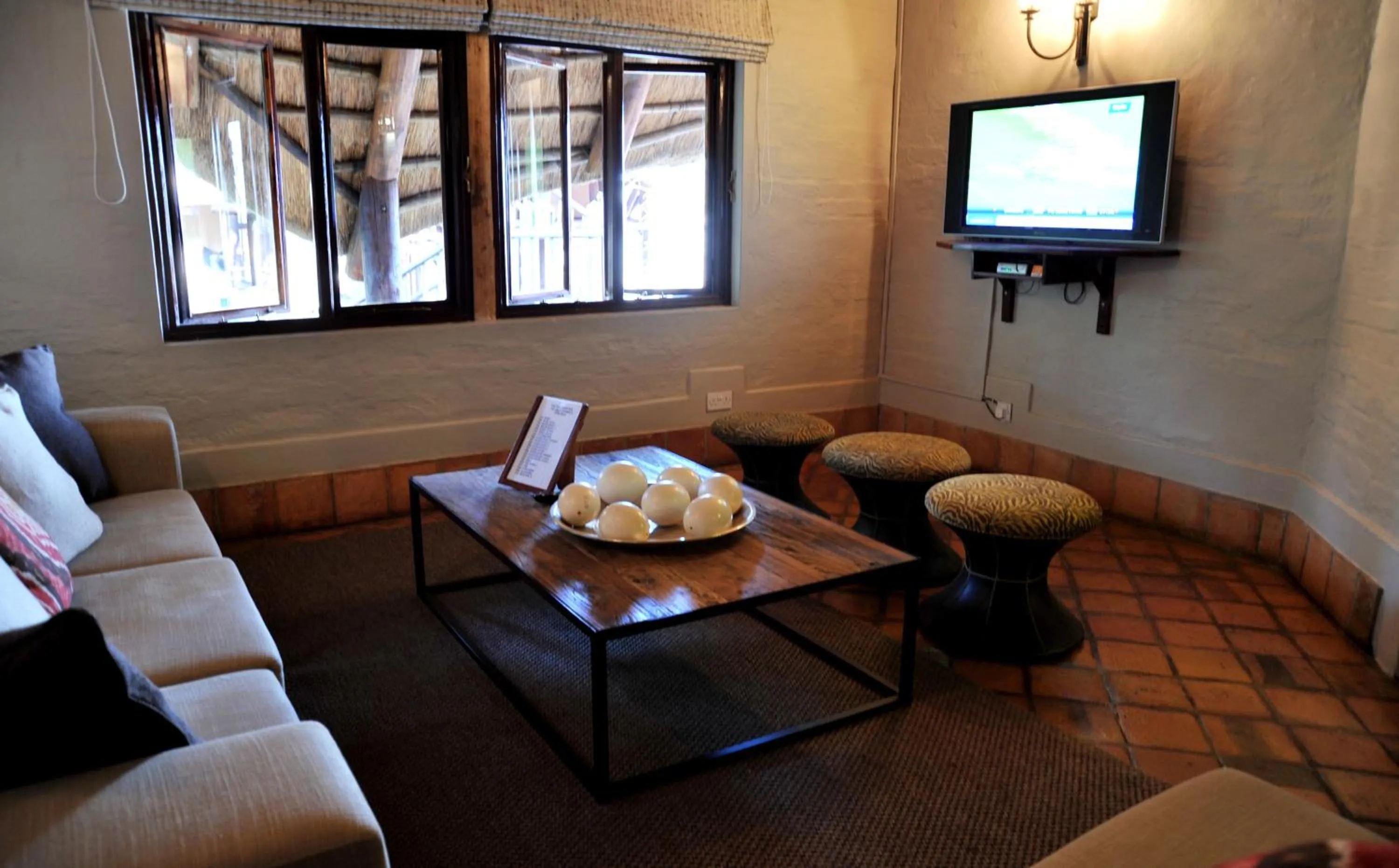 Communal lounge/ TV room in Victoria Falls Safari Lodge