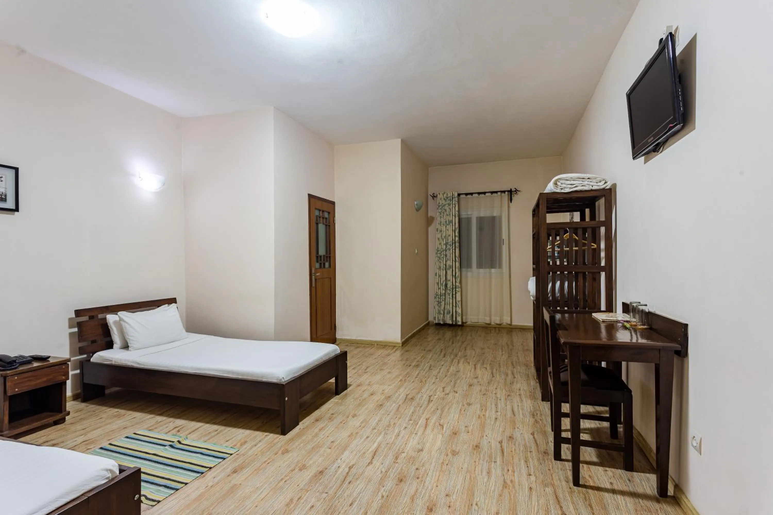 Photo of the whole room, Bed in Hotel H1 Antsirabe